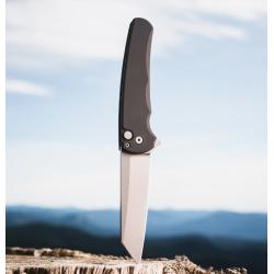 Malibu - Button Lock Flipper. Black handle with MAGNACUT Reverse Tanto blade, stonewash finish, blasted hardware. Plain Edge.