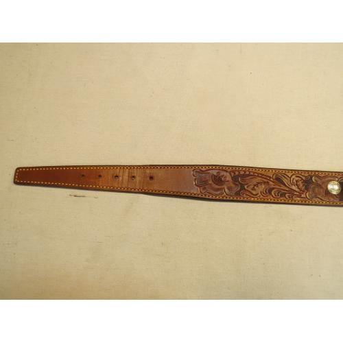 Engraved leather belt. 39"-43". Has 24 shell holders