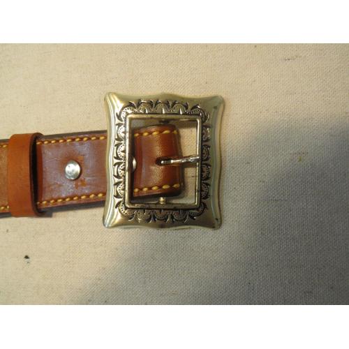 Engraved leather belt. 39"-43". Has 24 shell holders