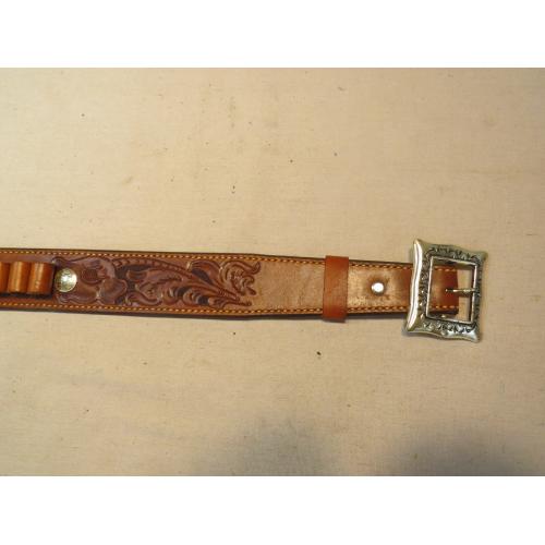 Engraved leather belt. 39"-43". Has 24 shell holders