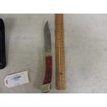 BUCK USA 110 SIGNED CHUCK BUCK CHAIRMAN SERIES CHERRY WOOD HANDLES KNIFE W/ LEATHER SHEATH