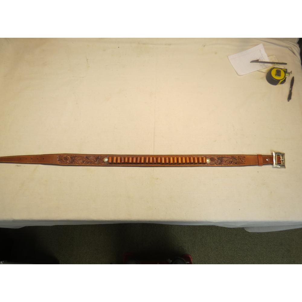Engraved leather belt. 39"-43". Has 24 shell holders
