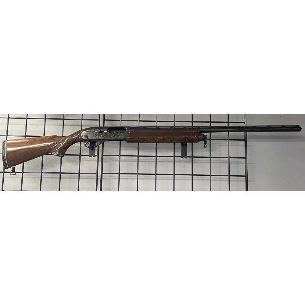 USED REMINGTON 1100 WITH CASE.