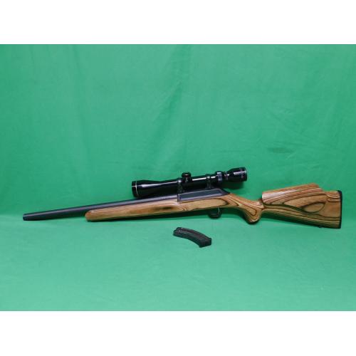 USED THOMPSON CENTER R-55 CLASSIC BENCHMARK 22LR 18" SEMI AUTO RIFLE. 1-10RD MAG & JAPANESE TASCO 3-9X40 SCOPE LAMINATE STOCK. HEAVY BBL. 98% (Consignment)