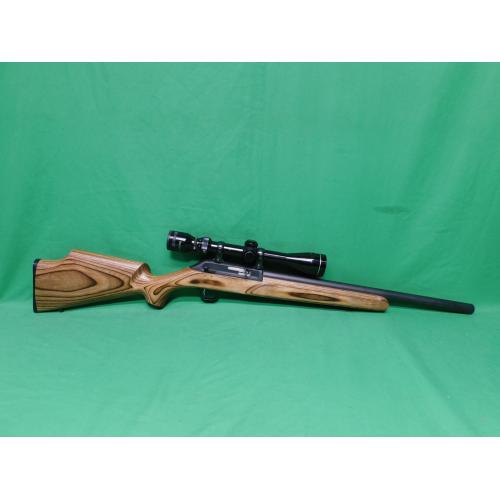 USED THOMPSON CENTER R-55 CLASSIC BENCHMARK 22LR 18" SEMI AUTO RIFLE. 1-10RD MAG & JAPANESE TASCO 3-9X40 SCOPE LAMINATE STOCK. HEAVY BBL. 98% (Consignment)