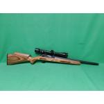 USED THOMPSON CENTER R-55 CLASSIC BENCHMARK 22LR 18" SEMI AUTO RIFLE. 1-10RD MAG & JAPANESE TASCO 3-9X40 SCOPE LAMINATE STOCK. HEAVY BBL. 98% (Consignment)