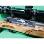 USED THOMPSON CENTER R-55 CLASSIC BENCHMARK 22LR 18" SEMI AUTO RIFLE. 1-10RD MAG & JAPANESE TASCO 3-9X40 SCOPE LAMINATE STOCK. HEAVY BBL. 98% (Consignment)