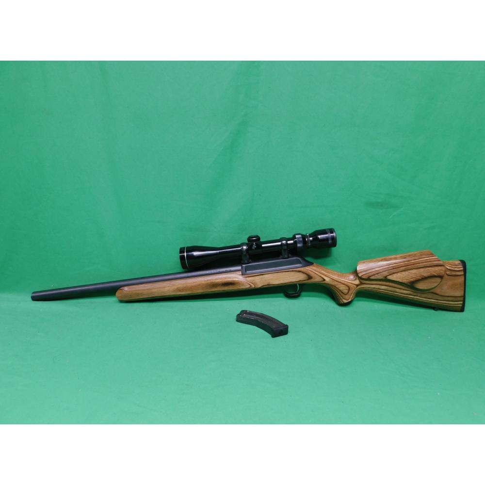 USED THOMPSON CENTER R-55 CLASSIC BENCHMARK 22LR 18" SEMI AUTO RIFLE. 1-10RD MAG & JAPANESE TASCO 3-9X40 SCOPE LAMINATE STOCK. HEAVY BBL. 98% (Consignment)