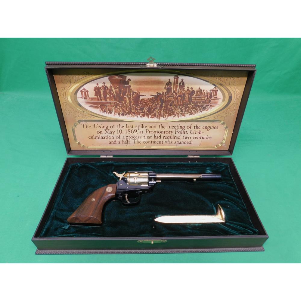 USED 1969 COLT FRONTIER SCOUT GOLDEN SPIKE .22LR 6" REVOLVER. BLACK AND GOLD AS ISSUED IN DISPLAY CASE W/SPIKE PAPERWORK. 98% ESTATE COLLECTION (Consignment)