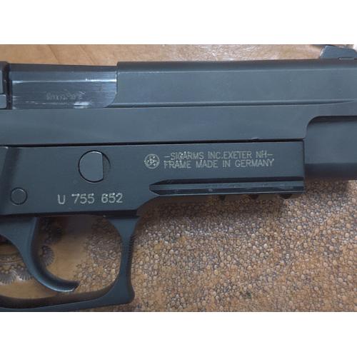 Pre-Owned Sig Sauer P226 with Crimson Trace Grips and original box. (Consignment)