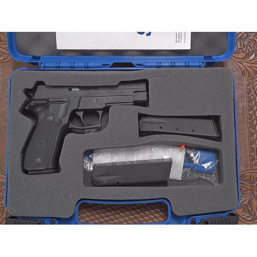 Pre-Owned Sig Sauer P226 with Crimson Trace Grips and original box. (Consignment)