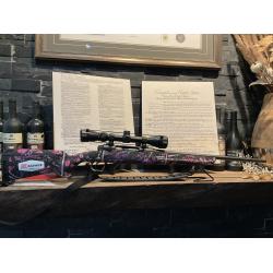 Savage Axis with the Muddy Girl cerakote finish chambered .243 win. Comes fitted with a Weaver 3-9x40 scope and a rifle sling