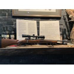 Used Mossberg Patriot, walnut stock with a Vortex Crossfire 3-9x40 hunting scope in excellent condition