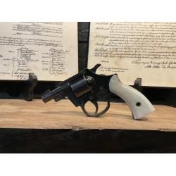 Used Armsco .22LR revolver with 7 round cylinder and pearl grips.