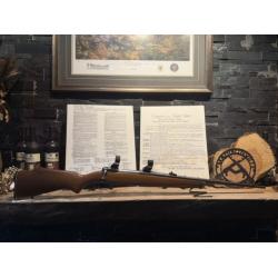Used Savage Model 110 chambered 30-06 with wood stock and scope rings.