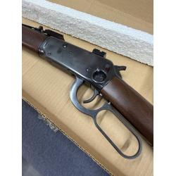 Lever Action 44. Nice metal but has several scratches on wood.  Left side ring and scope mount.  Original box. (Consignment)