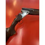 F.A.I.R Carrera IV - Nickel receiver with black script, FX wood with adjustable comb, ventilated midrib and buttplate, black lever and hinge pins, ported barrels, ABS case