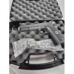ROCK ISLAND M1911 A2 IN 22TCM/9MM.  GOOD CONDITION.  COMES IN ORIGINAL BOX AND 1 MAG.