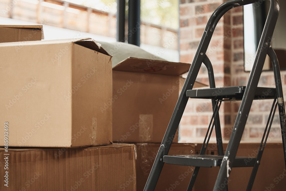 Estate boxes being sorted during a home cleanout in Florida