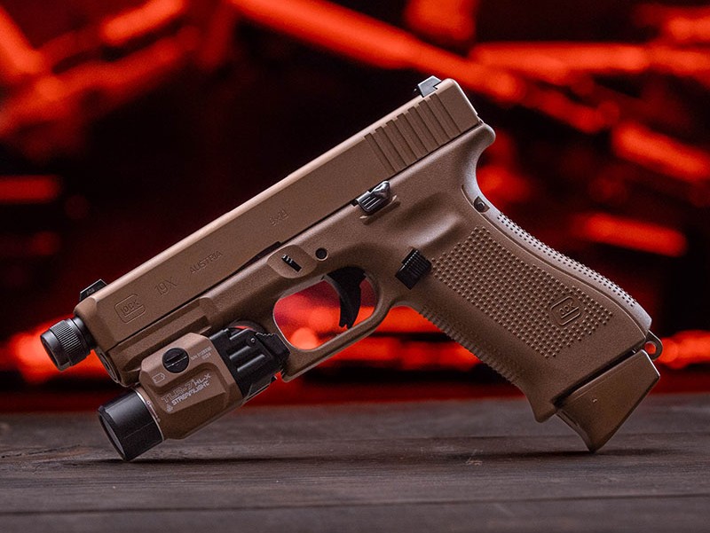 SureFire weapon light close-up showing turbo reflector and Scout Pro low-profile mount
