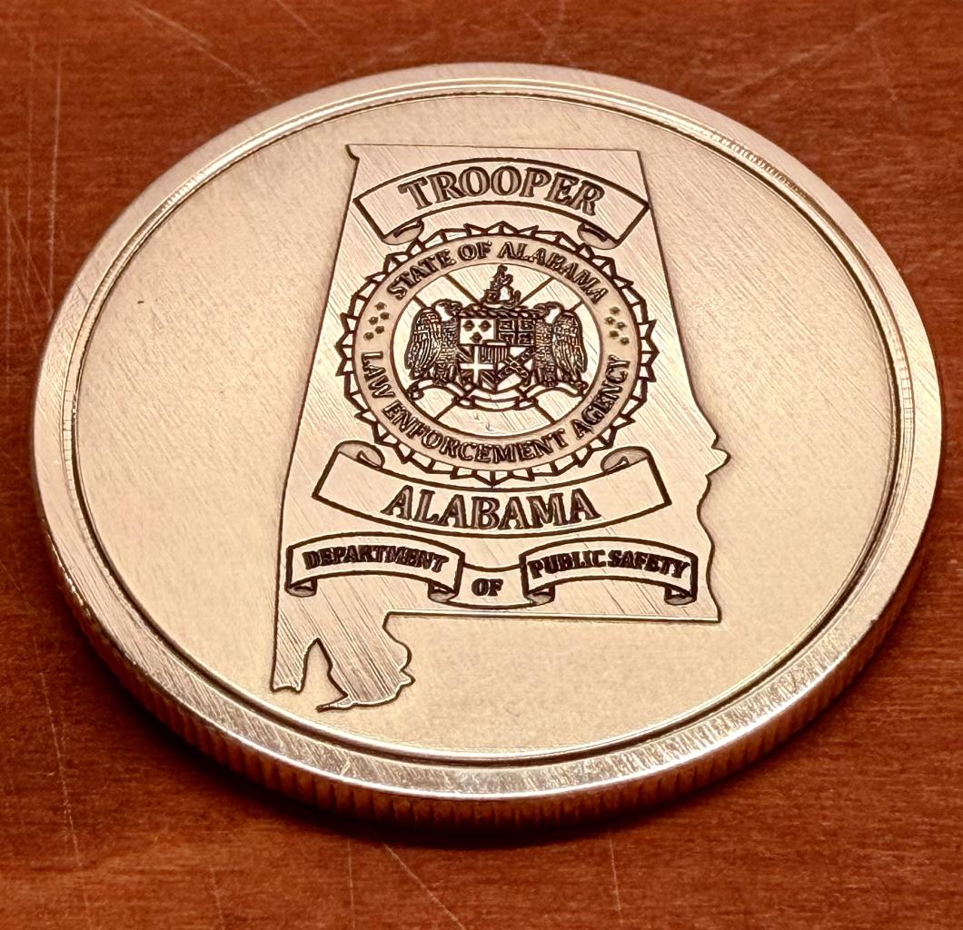 Alabama Law Enforcement Agency seal engraved on brass coin