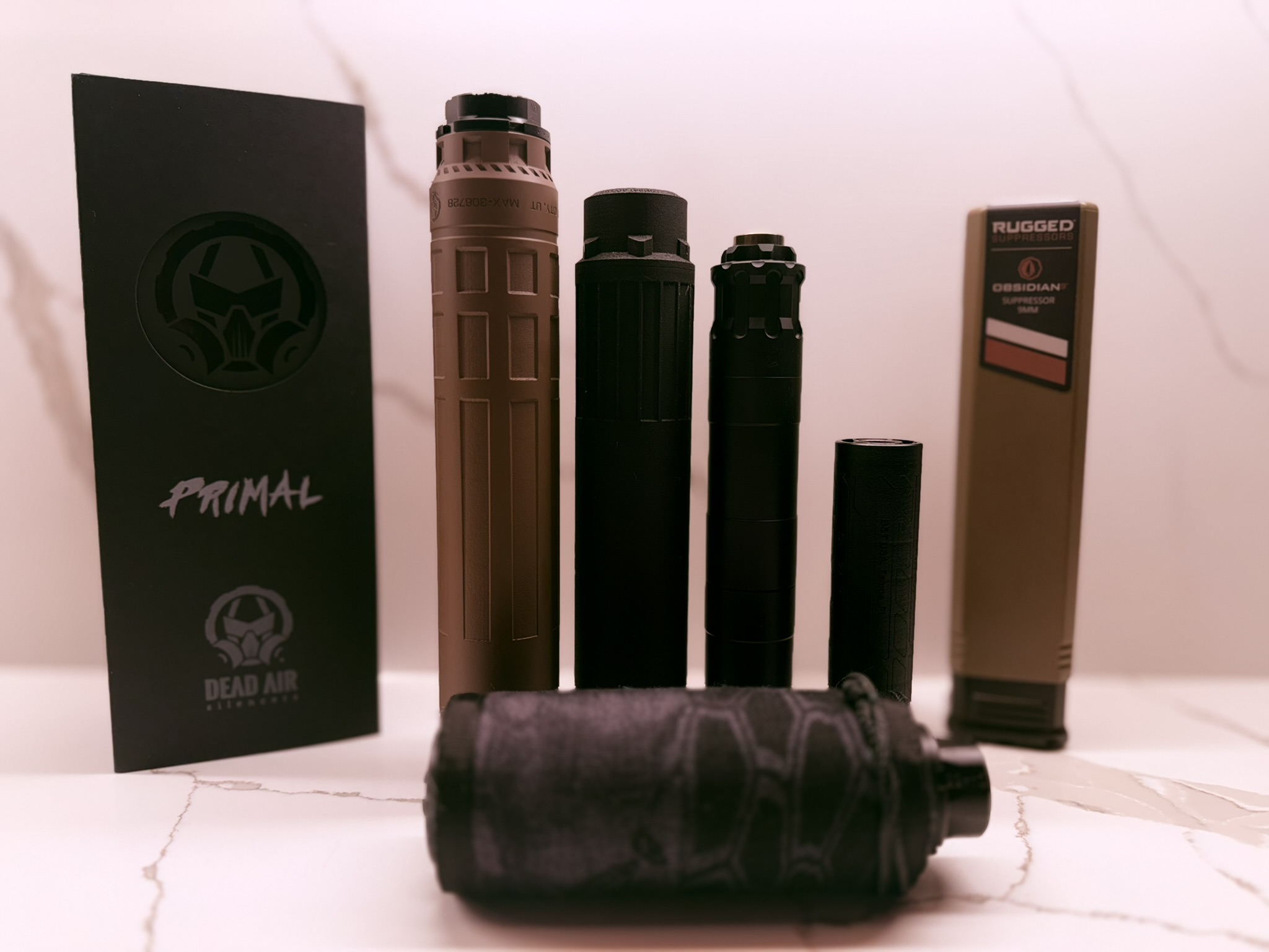 Comparison of several suppressors in different sizes and configurations